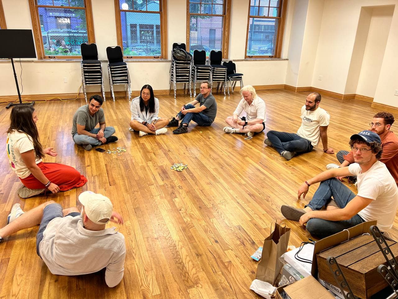 The crew doing an IRL Coordinape Give circle at the end of the conference